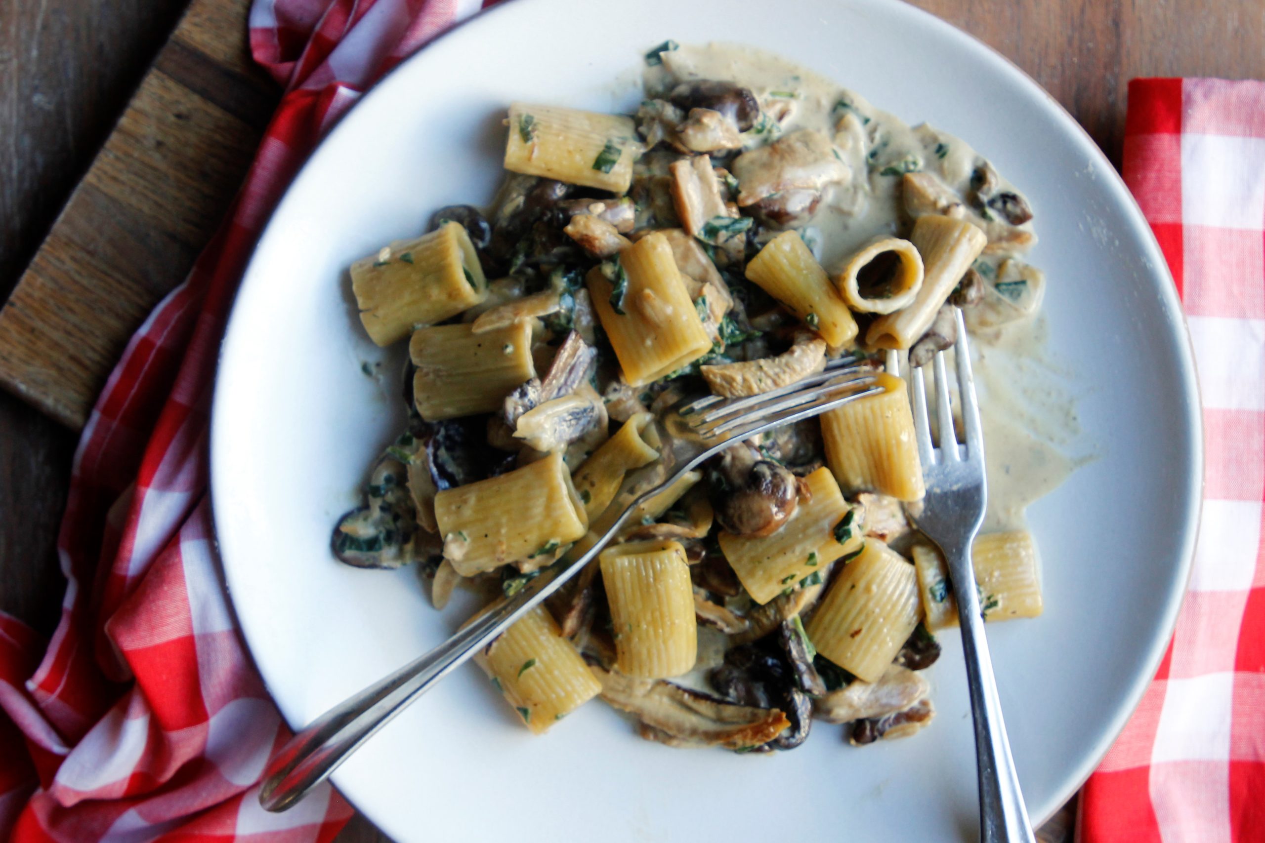 Creamy Mushroom Rigatoni on a plate with forks